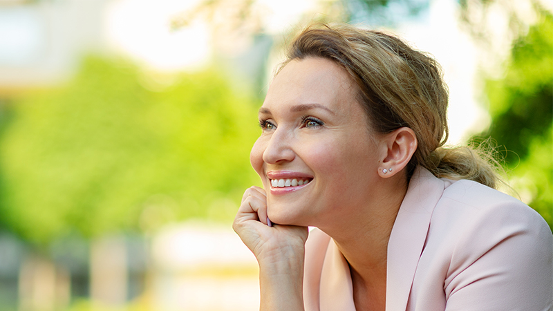 A 40 year old woman with a youthful face. Facial Rejuvenation concept.