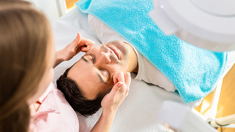 A man receiving a facial.