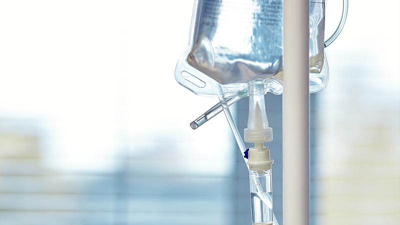 Close-up of an IV drip. IV infusion therapy concept.