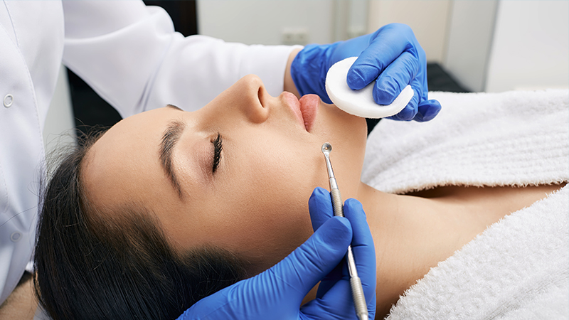 A woman receiving a spa treatment.